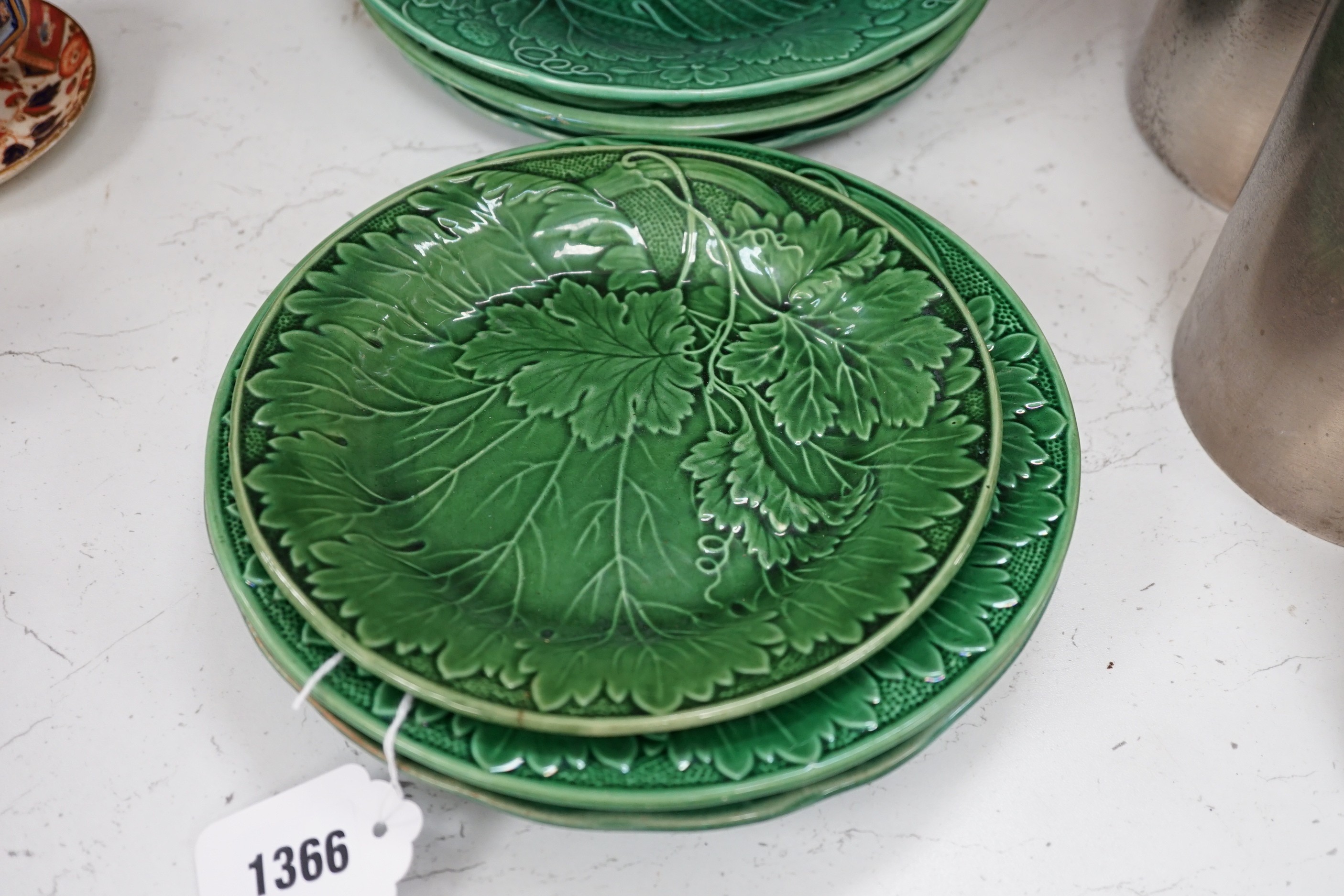 A collection of Victorian greenware leaf plates and dishes